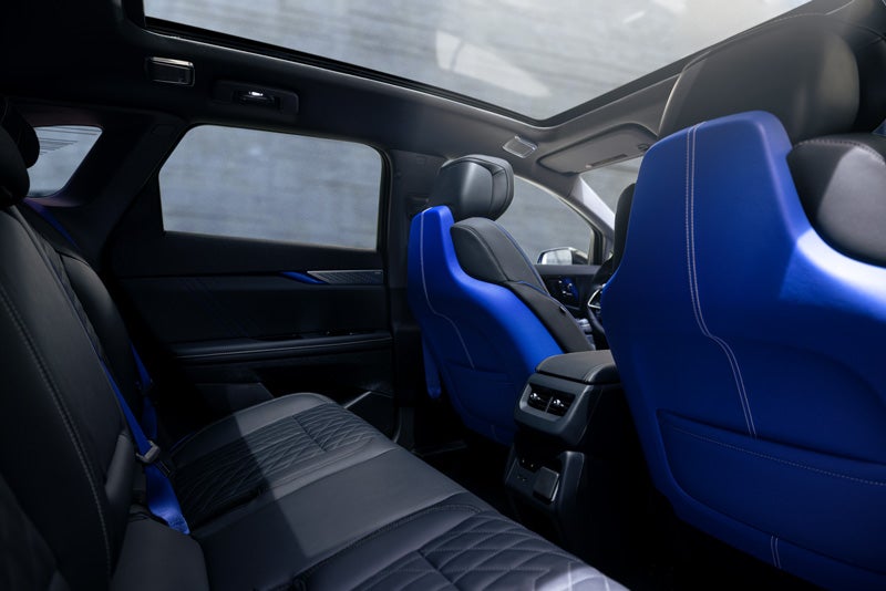 Back Seat View of the 2026 OPTIQ-V Blue Front Seats, Sun Roof, and Interior | Ryan Cadillac in Buffalo MN